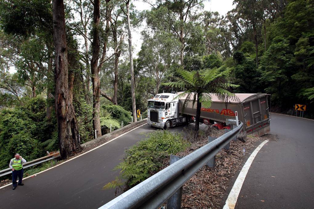 Truck stuck on hairpin bend on Macquarie Pass road in Australia