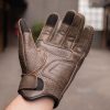 Left hand of man wearing Thumpa Summer Glove by Black Pup Moto